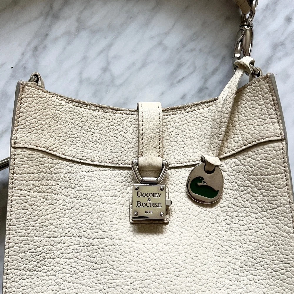 Dooney & Bourke Pebbled Leather Cream Shoulder Bag Duck Medallion Ivory